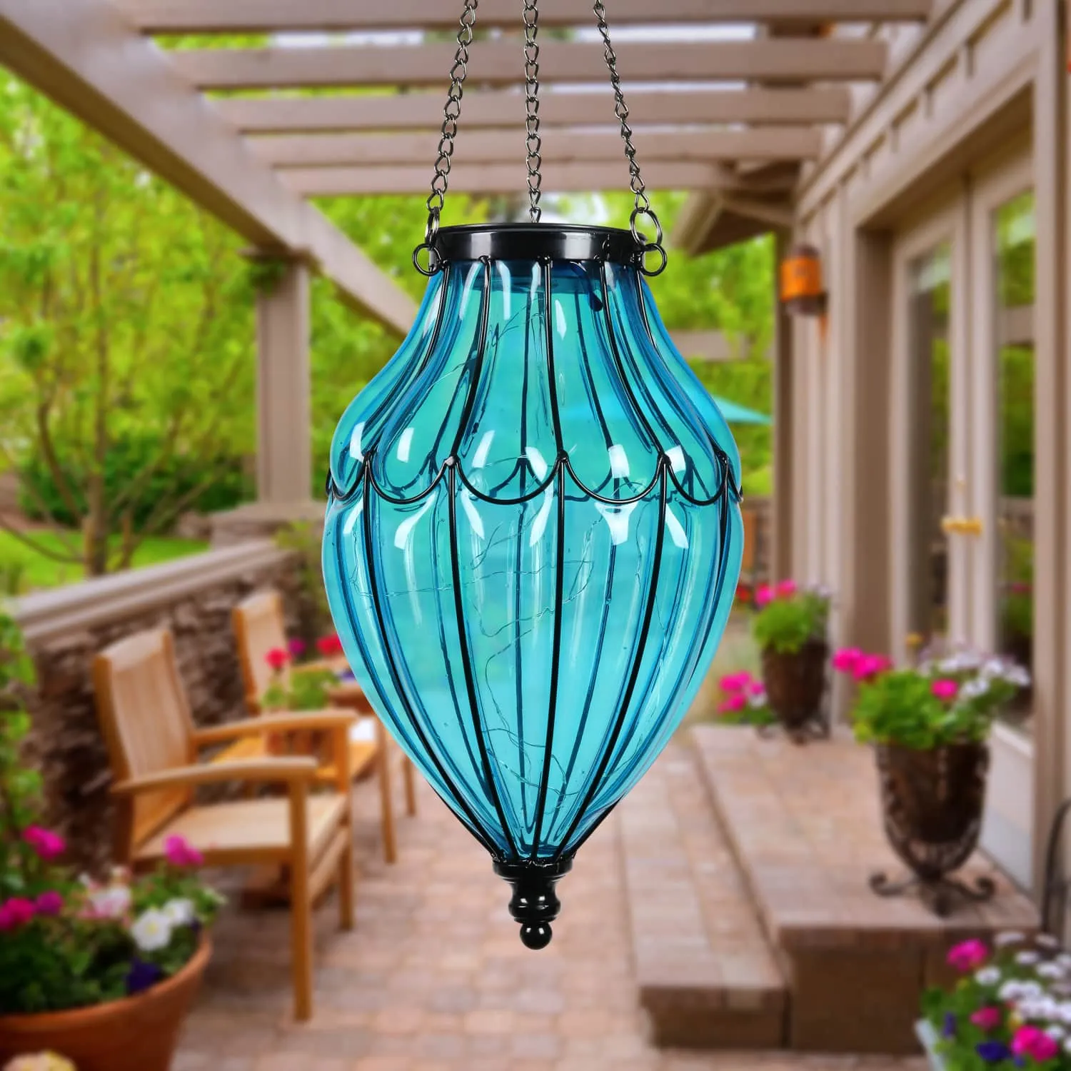 Solar Blue Glass Hanging Lantern with Waving Metal Pattern, 7.5 by 25 Inches